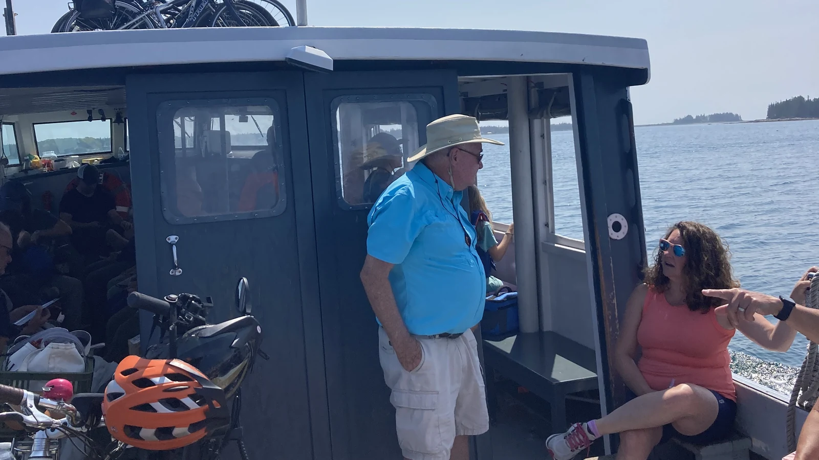 Passengers with bicycles aboard the Beal and Bunker mailboat departing Northeast Harbor, Maine
