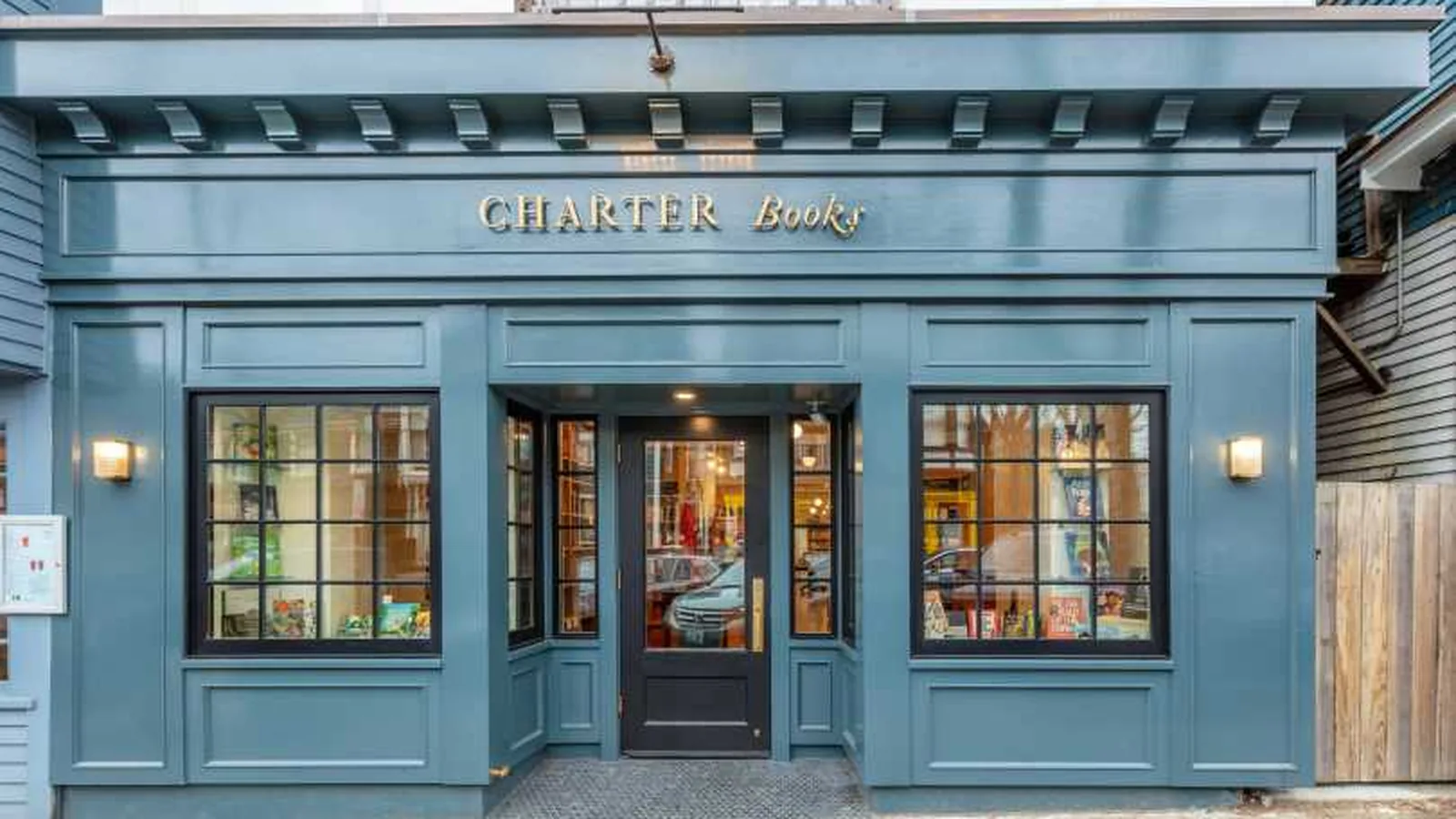 Blue-gray storefront of Charter Books on Broadway in Newport, Rhode Island.
