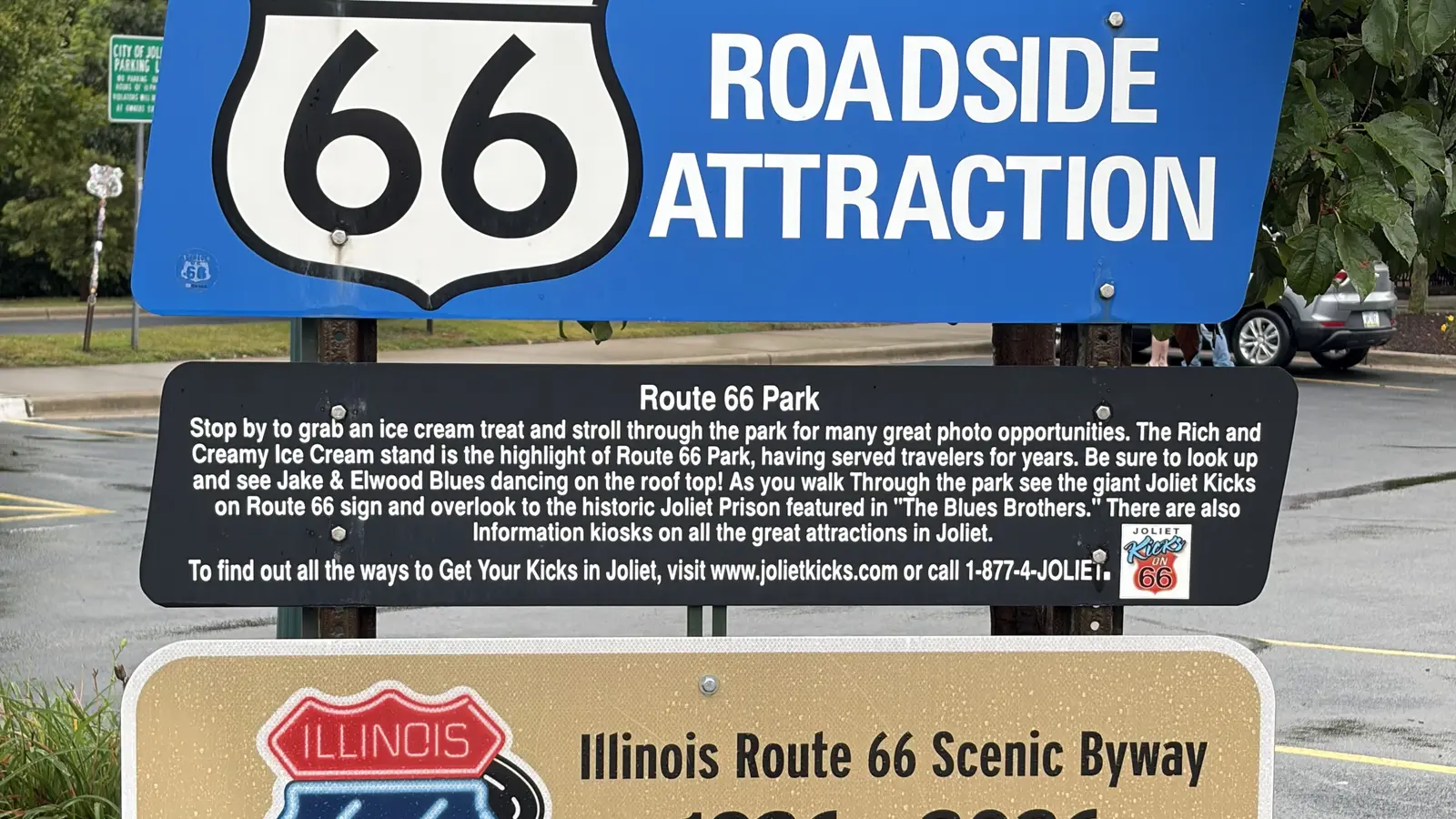 Route 66 roadside attraction sign and Illinois Route 66 Scenic Byway 1926-2026 centennial sign at Route 66 Park in Joliet, Illinois